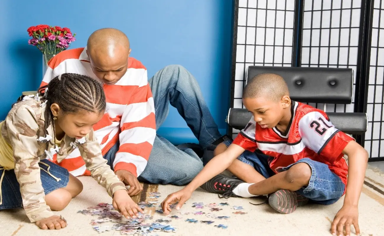 family playing puzzle.webp